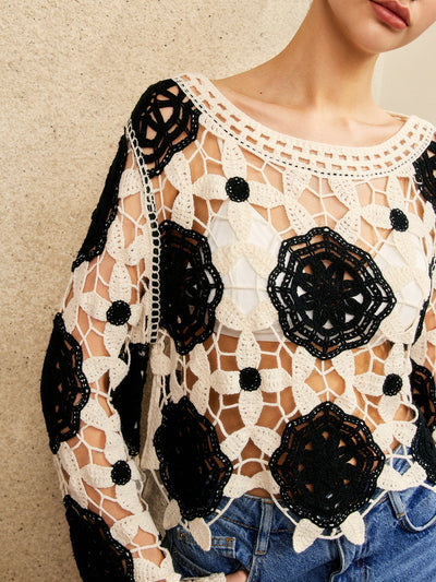 Pull à fleurs découpées en crochet